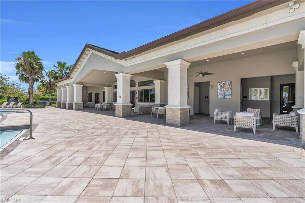 4644 Azalea Drive Naples, FL 34119 - Photo 42 of 48 a view of a house with backyard porch and sitting area