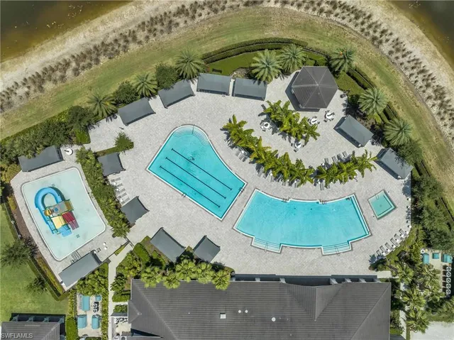 an aerial view of a house with a swimming pool