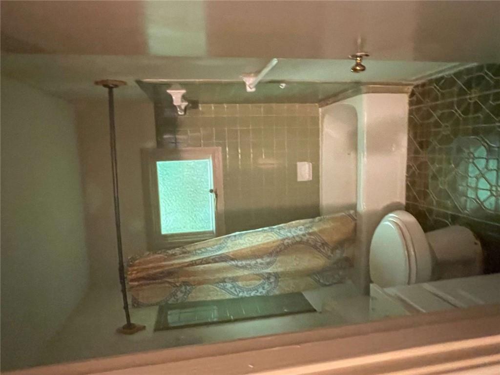 3409 Salem Road Covington, GA 30016 - Photo 8 of 16 a bathroom with a sink and a shower