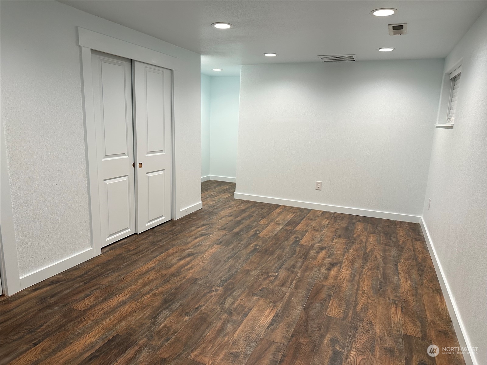 4520 Eels Road Cashmere, WA 98815 - Photo 13 of 17 an empty room with wooden floor and windows
