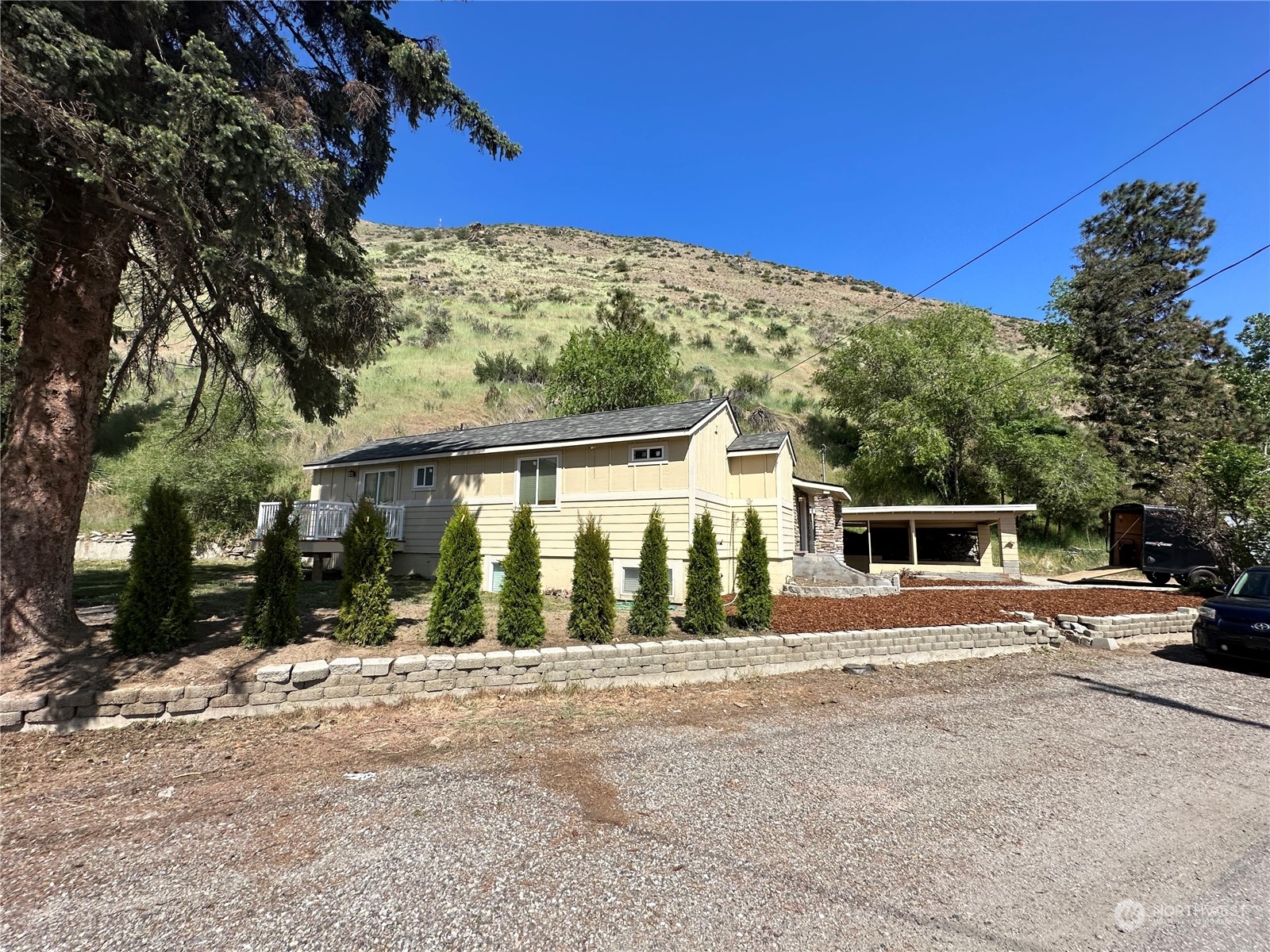 4520 Eels Road Cashmere, WA 98815 - Photo 17 of 17 a front view of a house with a yard