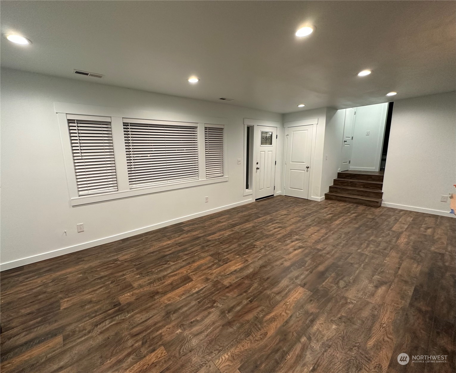 4520 Eels Road Cashmere, WA 98815 - Photo 4 of 17 an empty room with wooden floor and windows