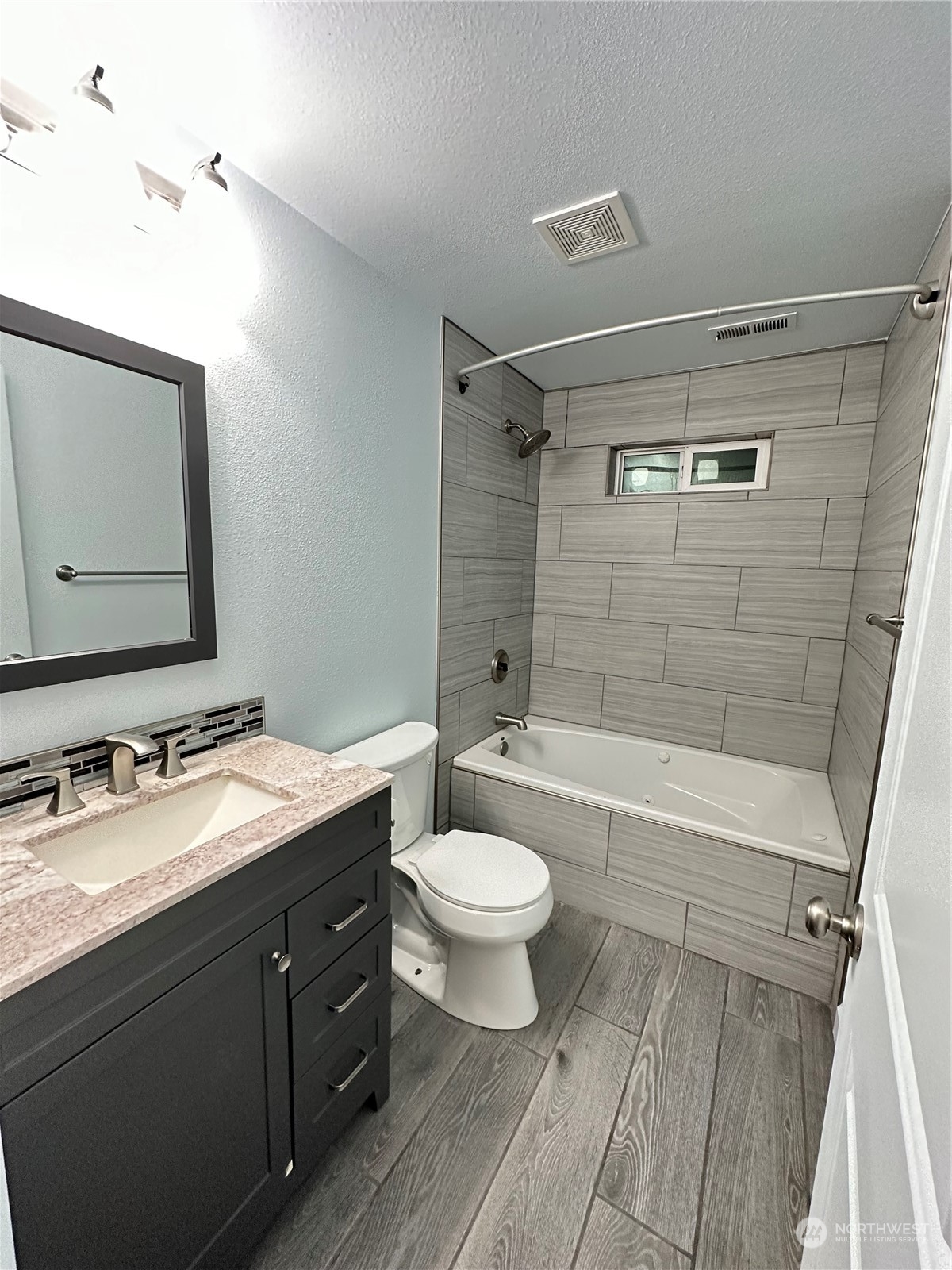 4520 Eels Road Cashmere, WA 98815 - Photo 7 of 17 a bathroom with a double vanity sink toilet mirror and shower