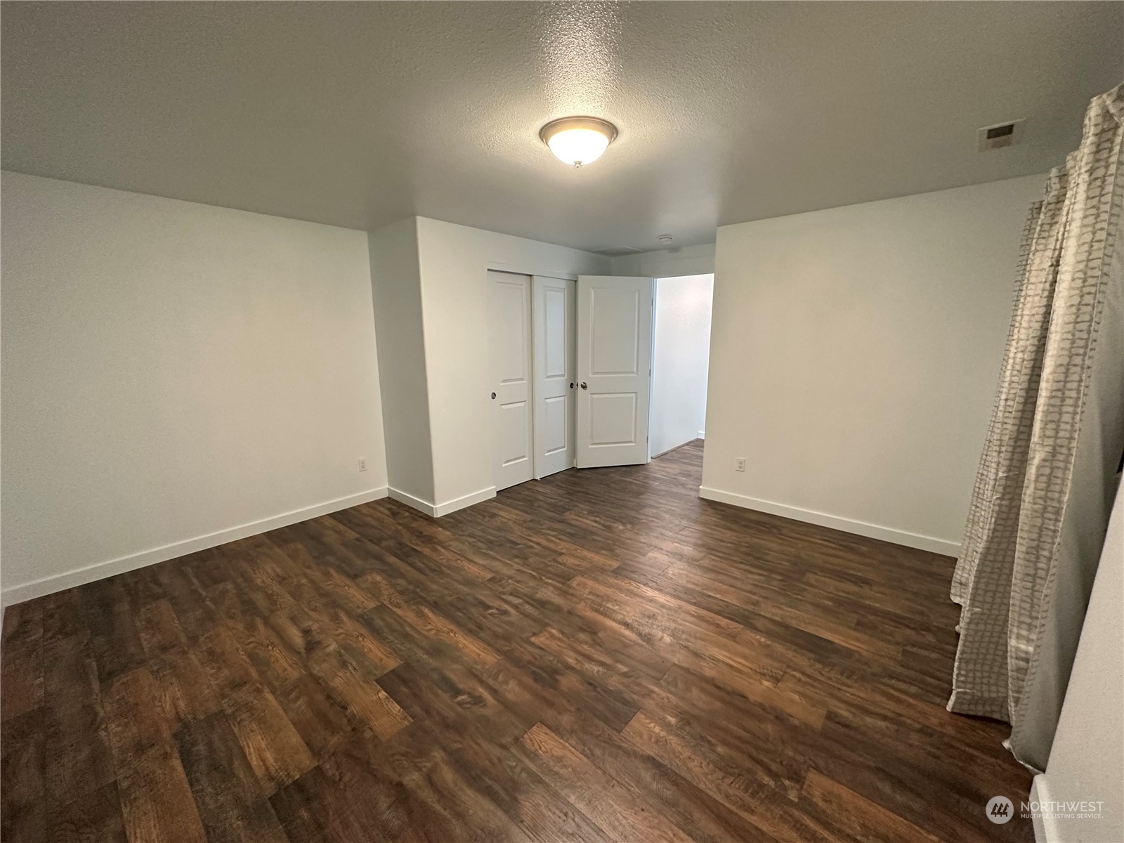 4520 Eels Road Cashmere, WA 98815 - Photo 9 of 17 a view of an empty room and wooden floor