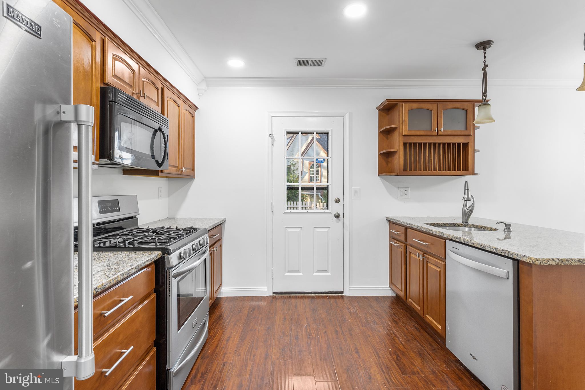16 Carlyle Court Robbinsville, NJ 08691 - Photo 15 of 30 a kitchen with stainless steel appliances granite countertop a stove and a sink