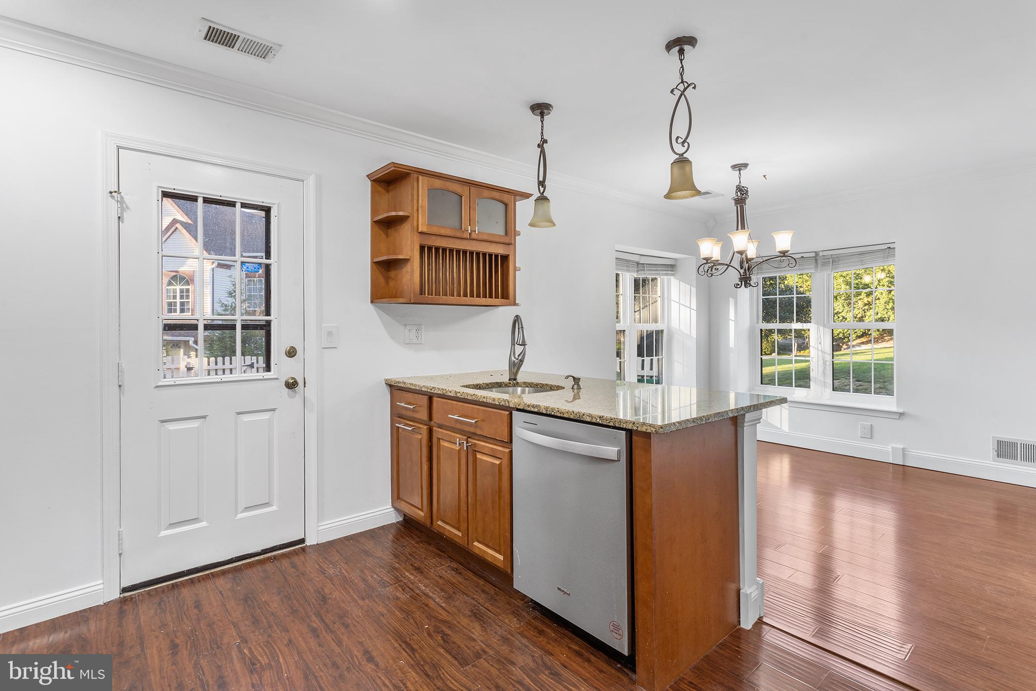 16 Carlyle Court Robbinsville, NJ 08691 - Photo 16 of 30 a kitchen with stainless steel appliances granite countertop a stove and a wooden floors