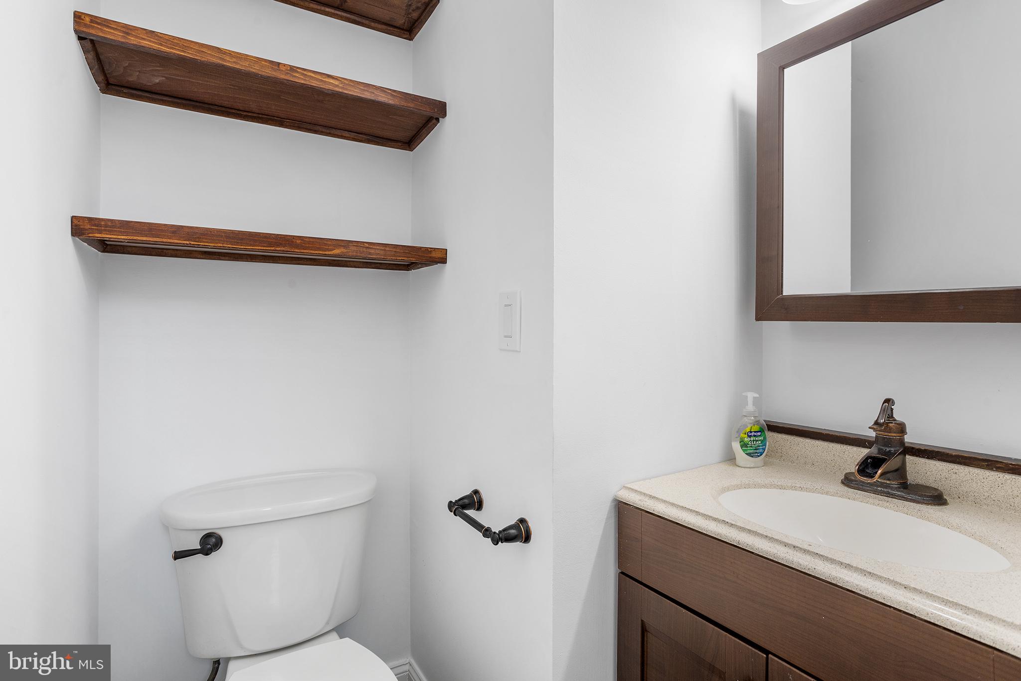 16 Carlyle Court Robbinsville, NJ 08691 - Photo 18 of 30 a bathroom with a sink a toilet and mirror