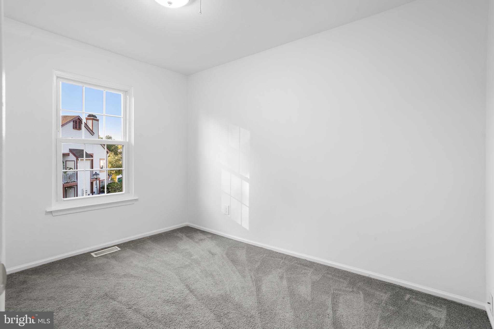 16 Carlyle Court Robbinsville, NJ 08691 - Photo 25 of 30 a view of an empty room with a window