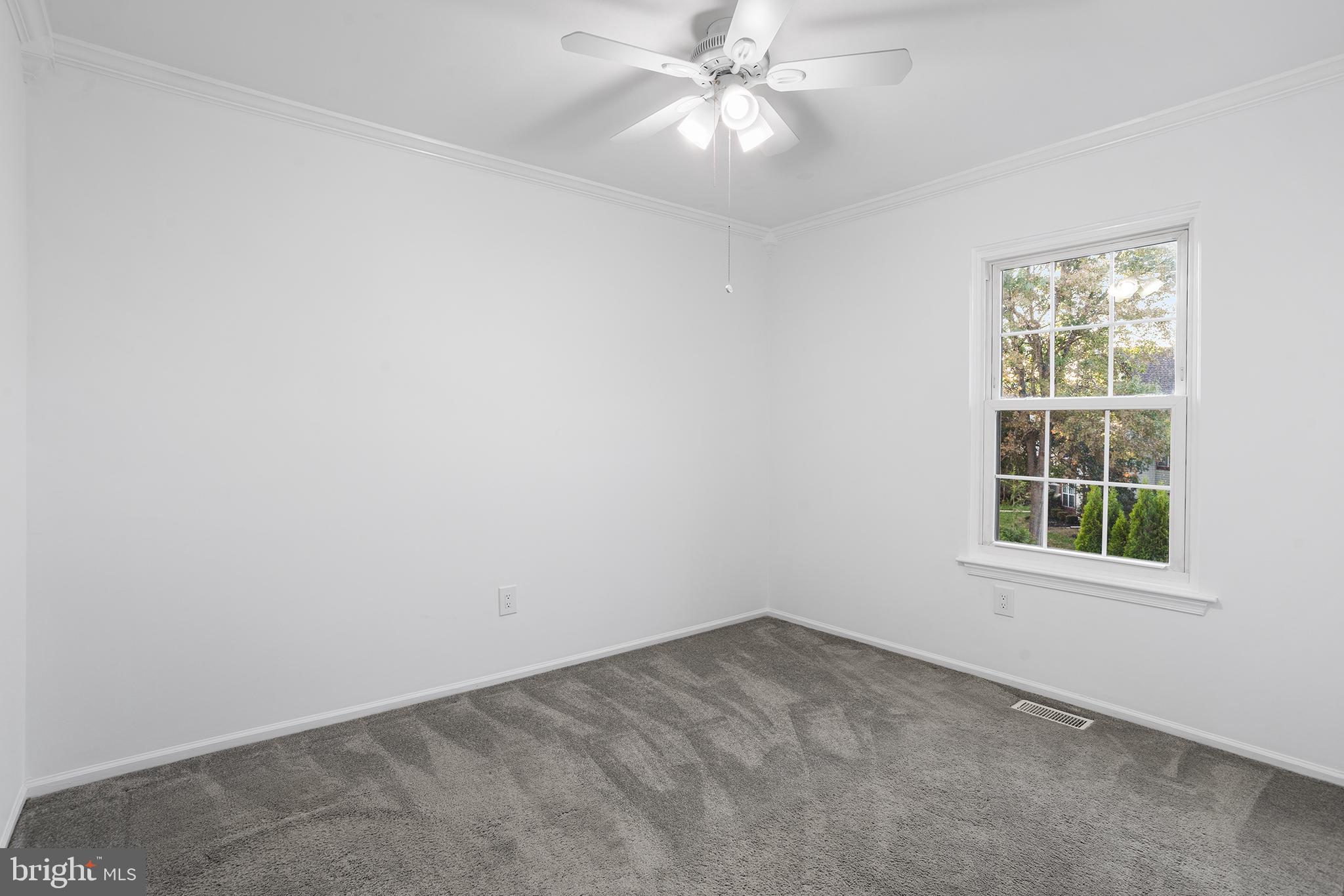 16 Carlyle Court Robbinsville, NJ 08691 - Photo 27 of 30 an empty room with a window and a fan
