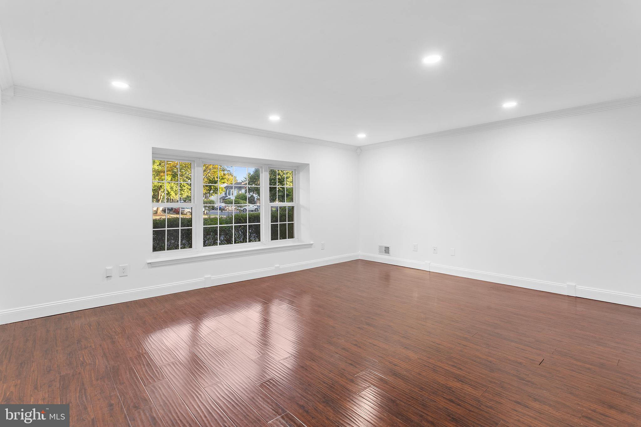 16 Carlyle Court Robbinsville, NJ 08691 - Photo 8 of 30 a view of an empty room with wooden floor and a window
