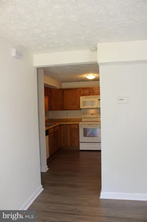 a kitchen with stainless steel appliances a refrigerator and a stove