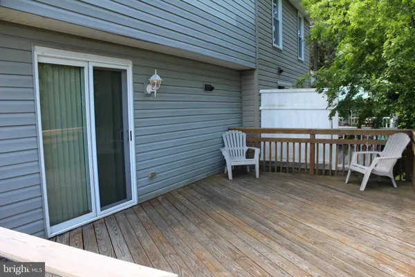 a view of a wooden deck with a bench