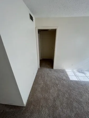 a view of hallway with closet