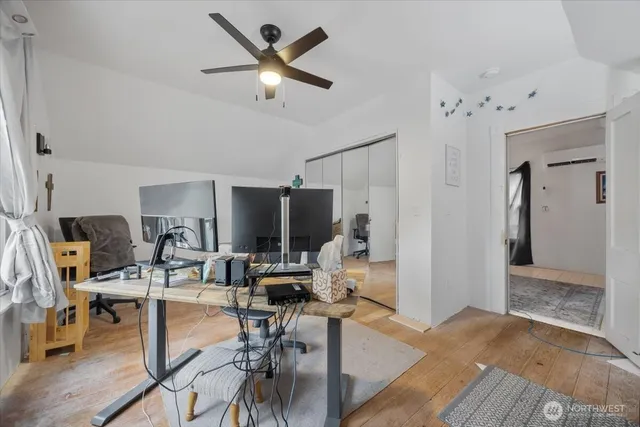 a bedroom with bed and a window