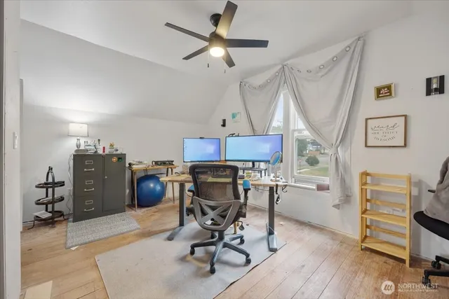 a view of backyard of house with outdoor seating and green space