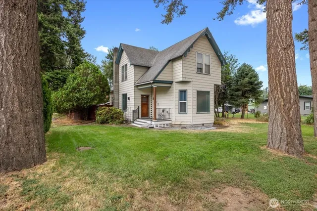 a front view of a house with a yard