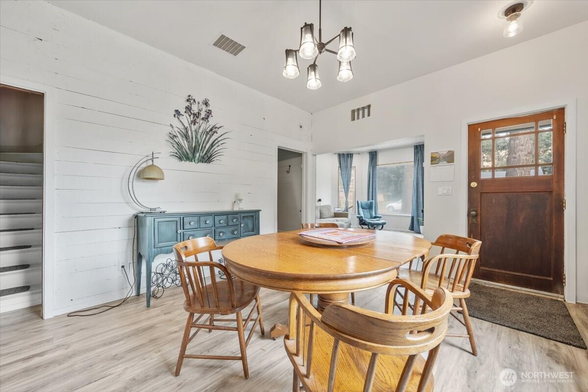515 North 3rd Street Dayton, WA 99328 - Photo 8 of 31 a dining room with furniture a chandelier and wooden floor