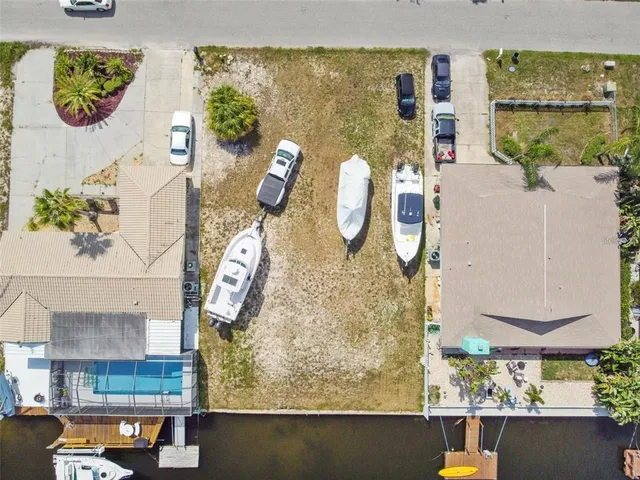 an aerial view of a house with a swimming pool