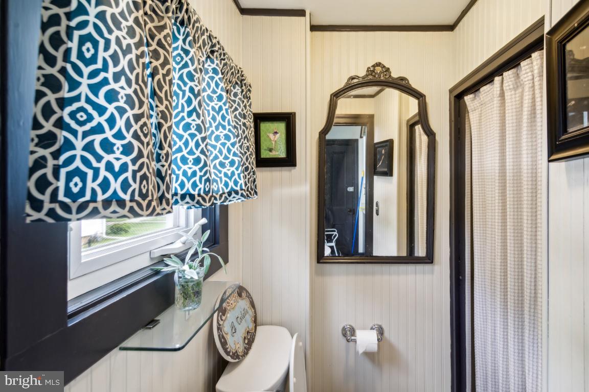 503 Kings Highway Mickleton, NJ 08056 - Photo 15 of 26 a bathroom with a toilet and a shower curtain