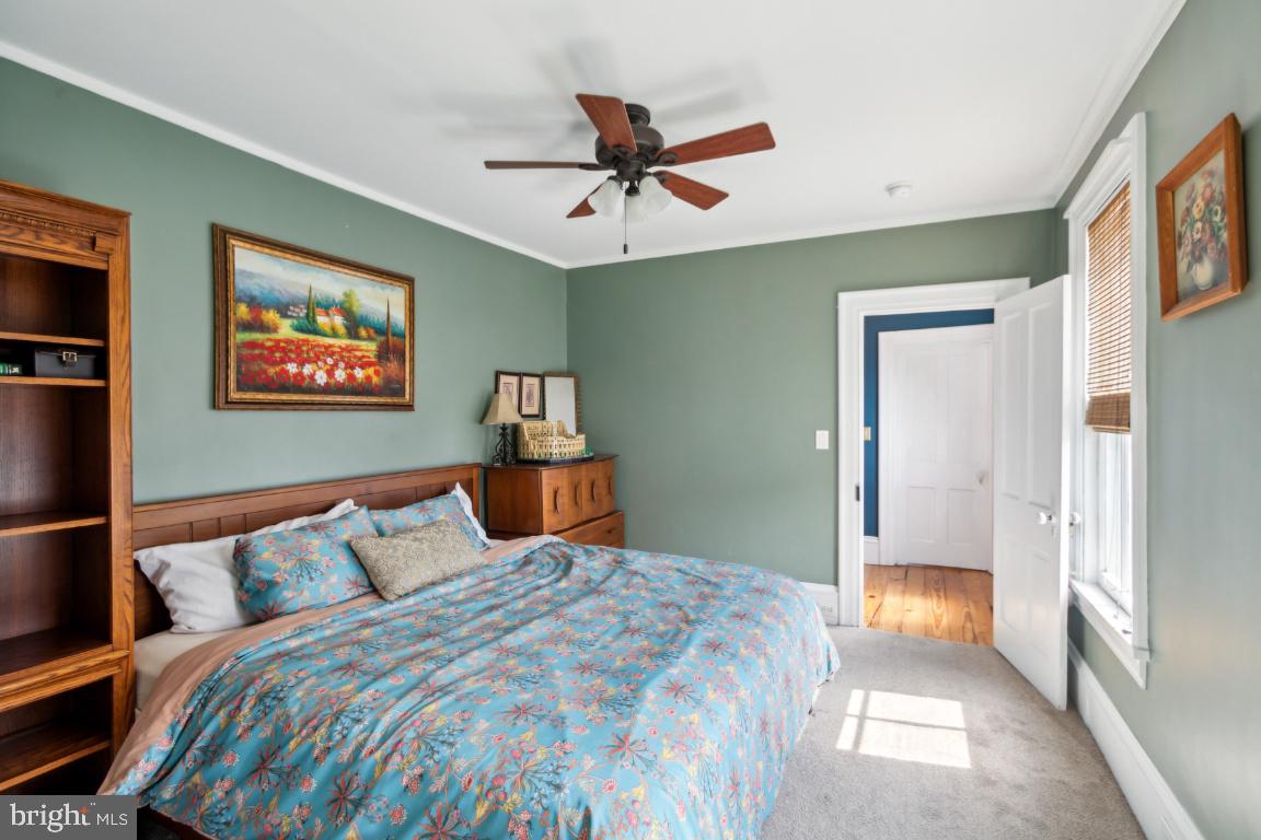 503 Kings Highway Mickleton, NJ 08056 - Photo 16 of 26 a bedroom with a bed and a chandelier