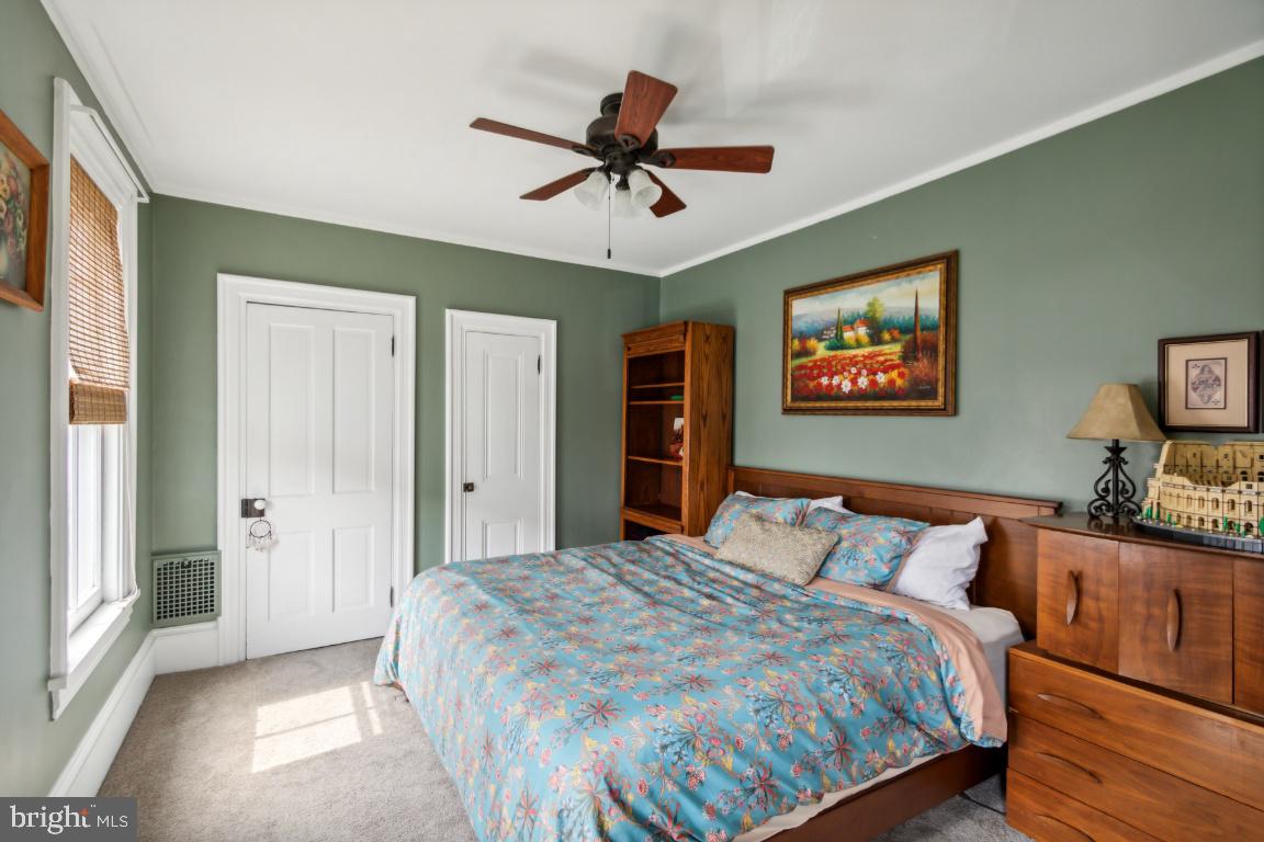 503 Kings Highway Mickleton, NJ 08056 - Photo 17 of 26 a bedroom with a bed and a chandelier