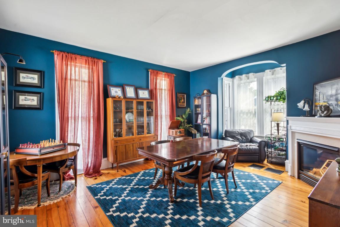 503 Kings Highway Mickleton, NJ 08056 - Photo 8 of 26 a dining room with furniture a floor to ceiling window and wooden floor