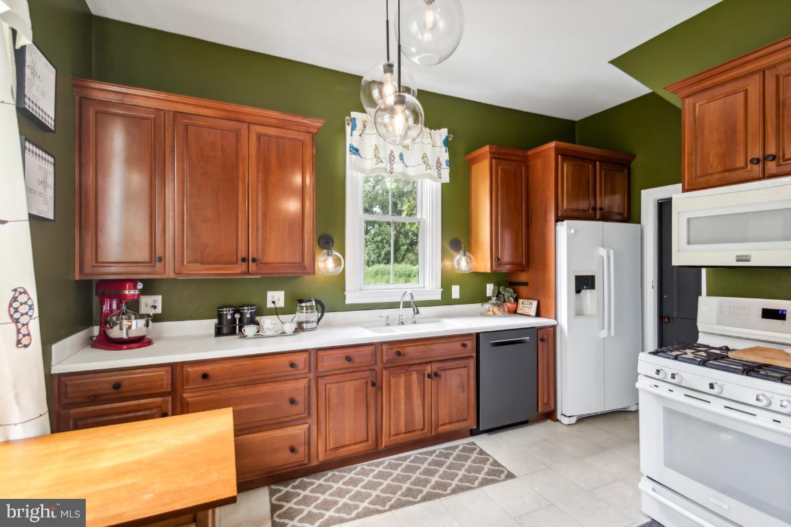 503 Kings Highway Mickleton, NJ 08056 - Photo 10 of 26 a kitchen with stainless steel appliances granite countertop a refrigerator sink and cabinets