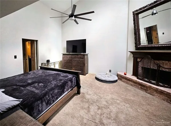 a bedroom with bed and tv
