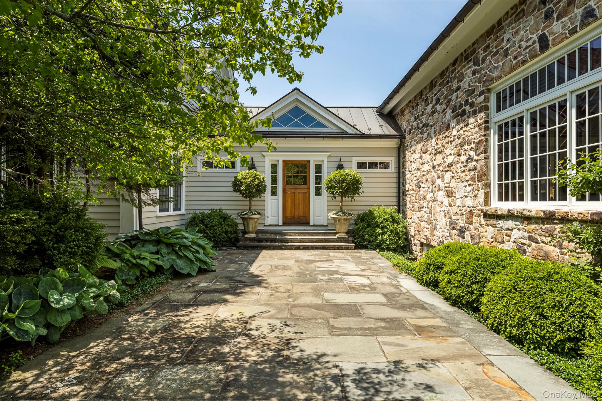 147 Moadock Road Millerton, NY 12546 - Photo 22 of 48 a front view of a house with garden