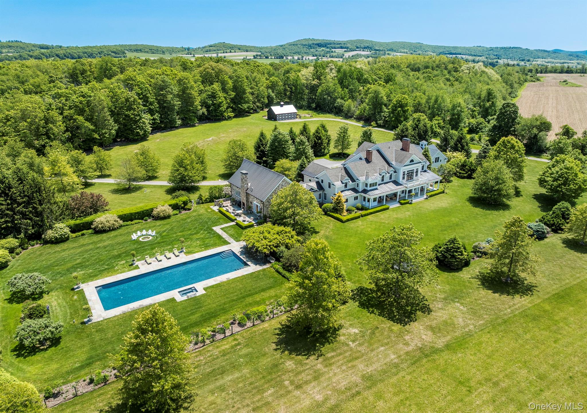 147 Moadock Road Millerton, NY 12546 - Photo 6 of 48 a view of a garden with a lake