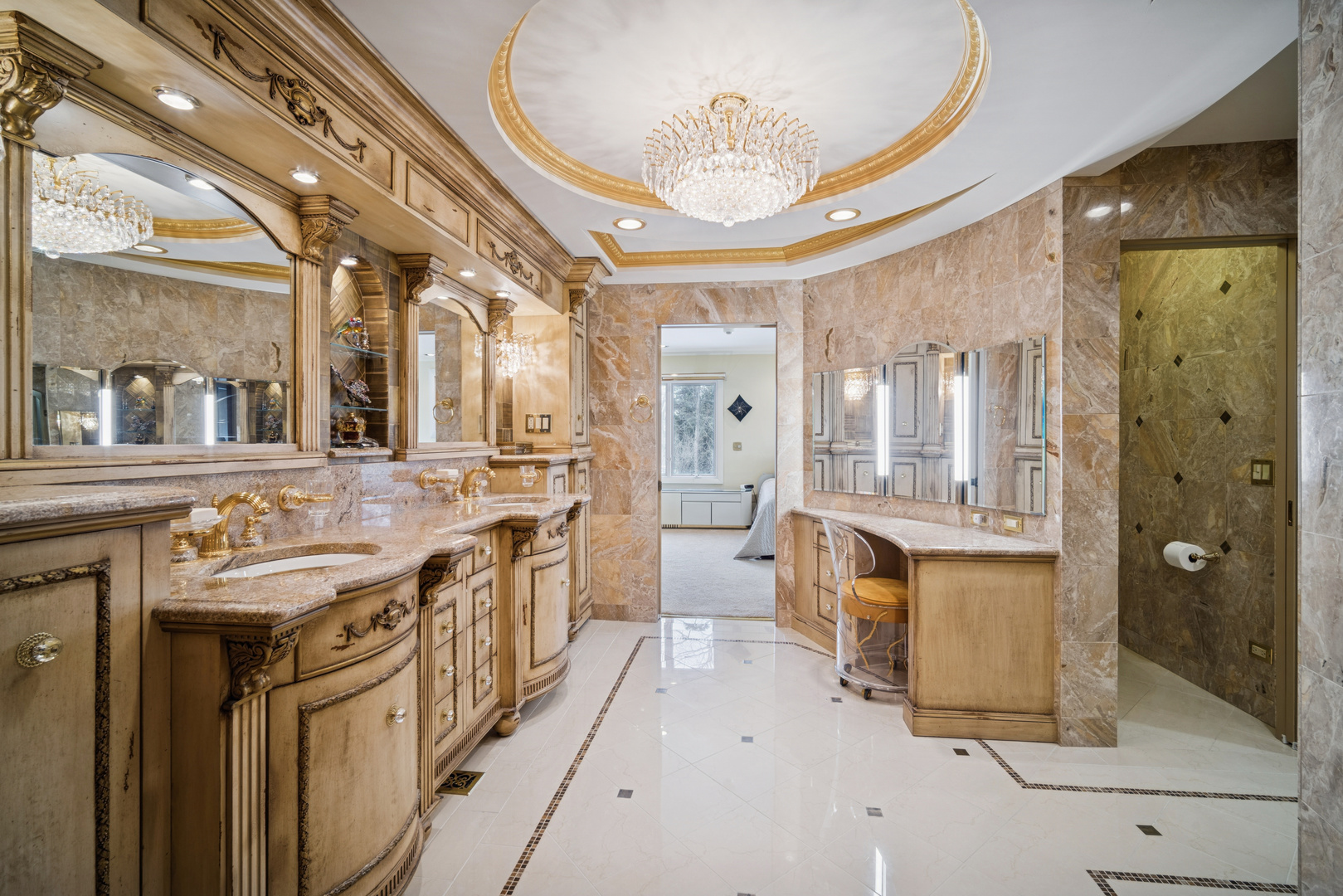 990 Heather Road Deerfield, IL 60015 - Photo 18 of 28 a spacious bathroom with a double vanity sink a mirror and a shower