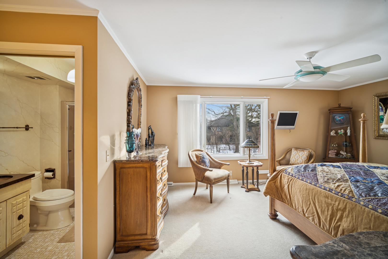 990 Heather Road Deerfield, IL 60015 - Photo 21 of 28 a bedroom with a bed and large window with chair
