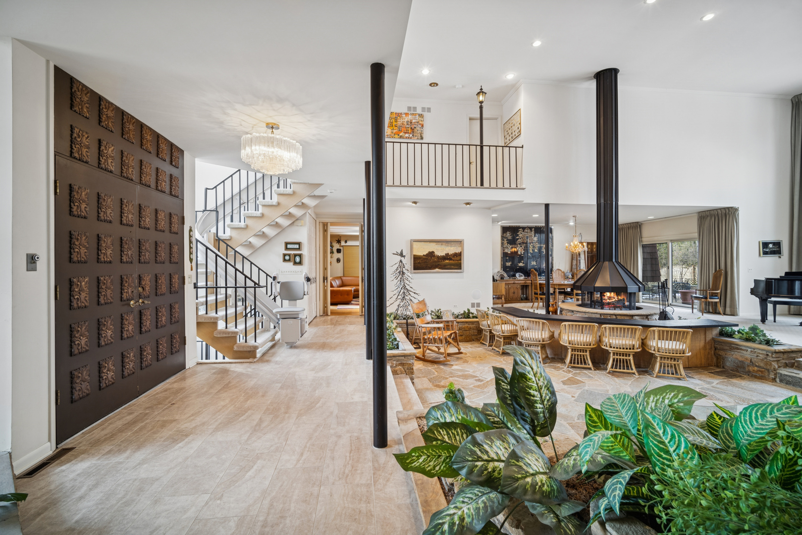 990 Heather Road Deerfield, IL 60015 - Photo 4 of 28 a living room with fireplace furniture and a potted plant