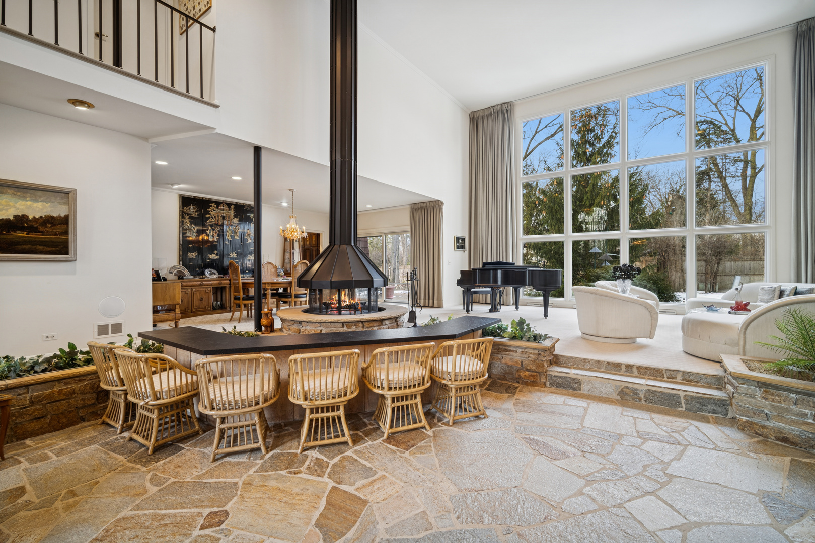 990 Heather Road Deerfield, IL 60015 - Photo 5 of 28 a living room with furniture a large window and potted plants