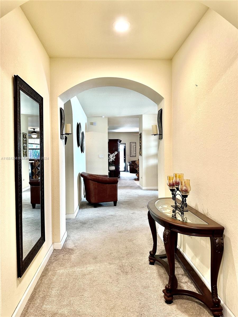 24162 Southwest 115th Court Homestead, FL 33032 - Photo 2 of 8 a living room with furniture