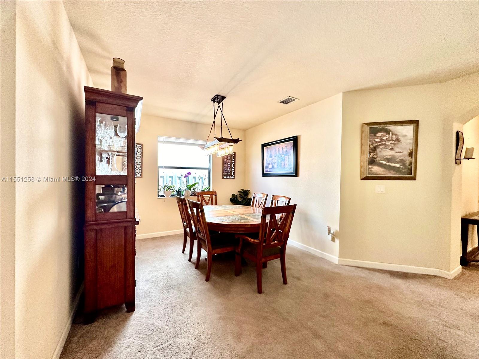 24162 Southwest 115th Court Homestead, FL 33032 - Photo 4 of 8 a view of a dining room with furniture