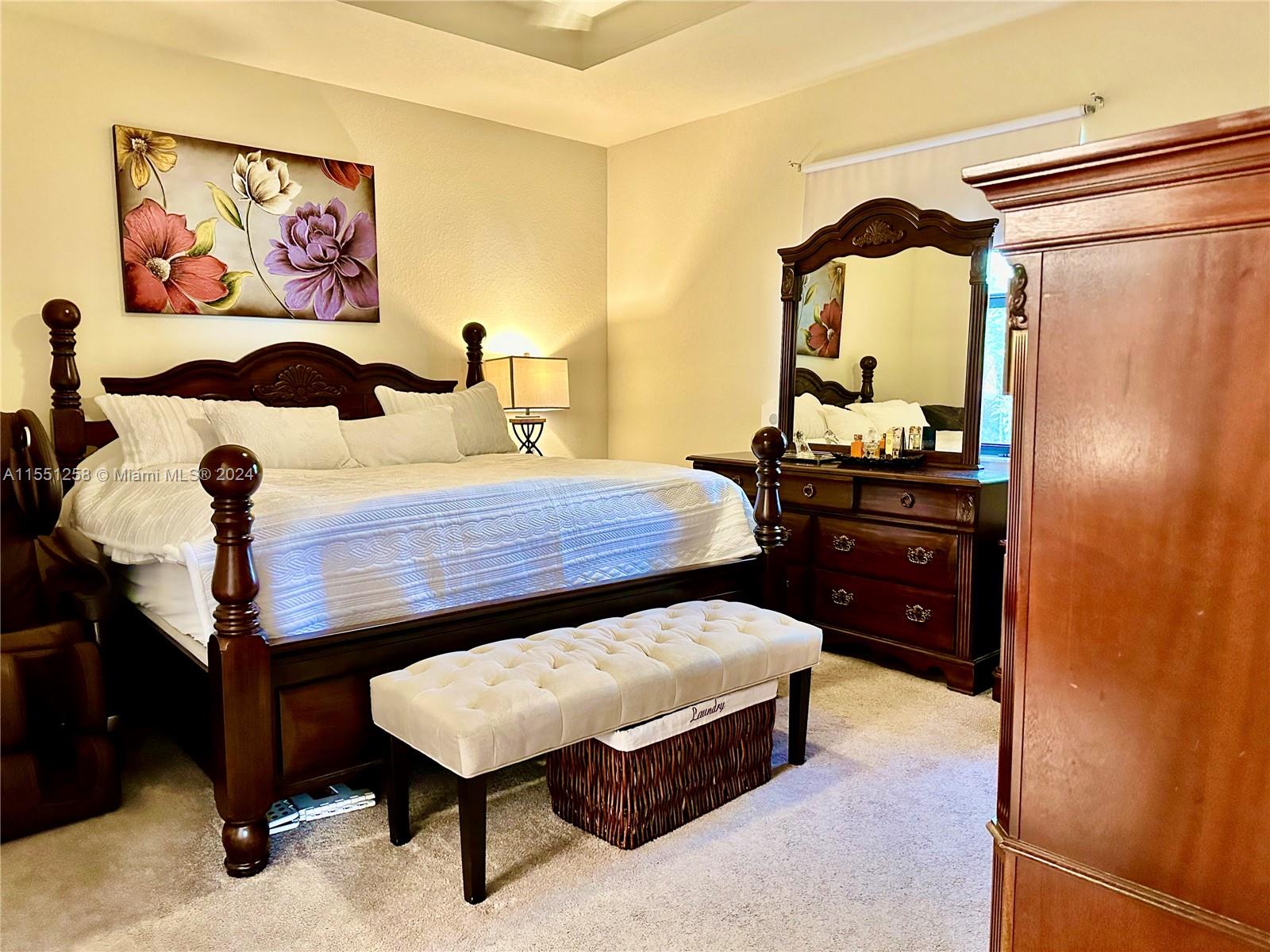 24162 Southwest 115th Court Homestead, FL 33032 - Photo 5 of 8 a bedroom with a bed and dresser