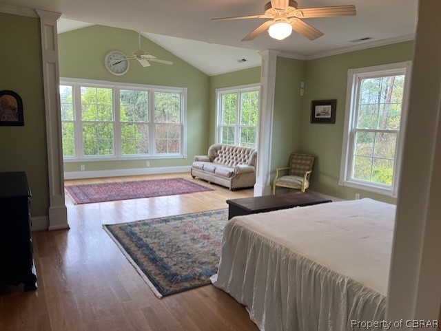 507 Sunnybank Road Reedville, VA 22539 - Photo 38 of 48 Bedroom featuring hardwood / wood-style flooring, ceiling fan, decorative columns, and lofted ceiling