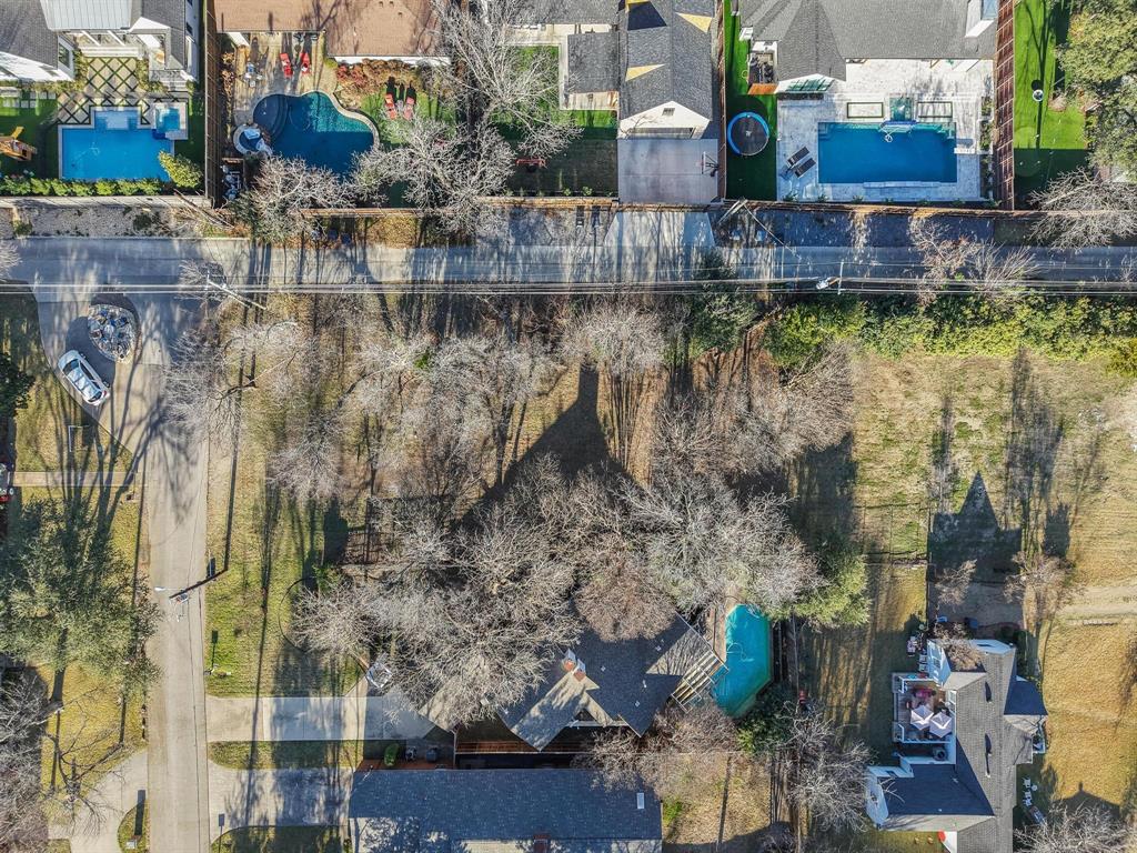 8058 Eagle Trail Dallas, TX 75238 - Photo 2 of 24 a view of a lake with a house