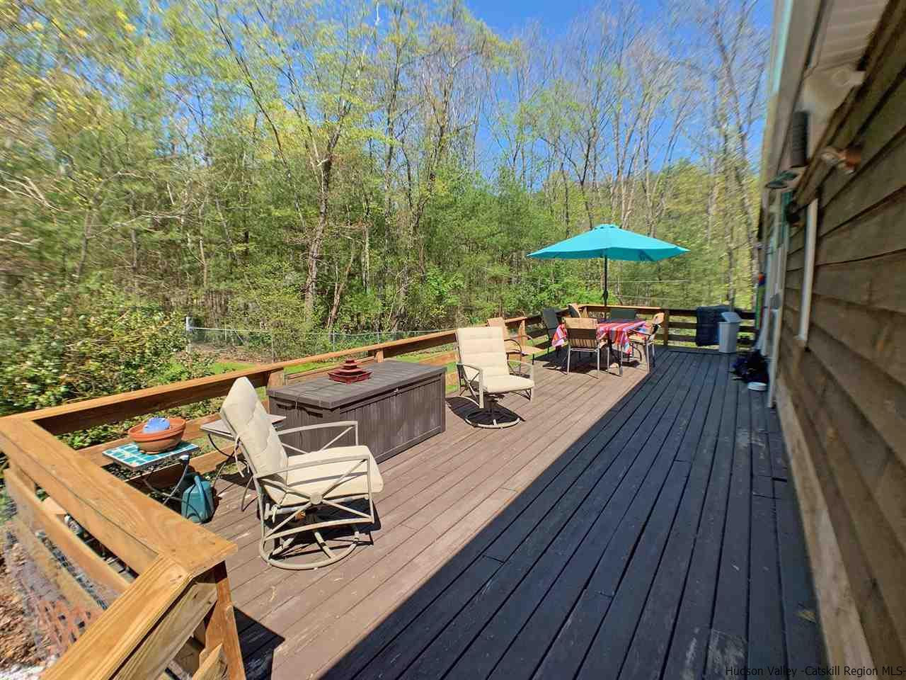56 Bellwood Road Saugerties, NY 12477 - Photo 11 of 35 a view of a balcony with chairs and wooden floor