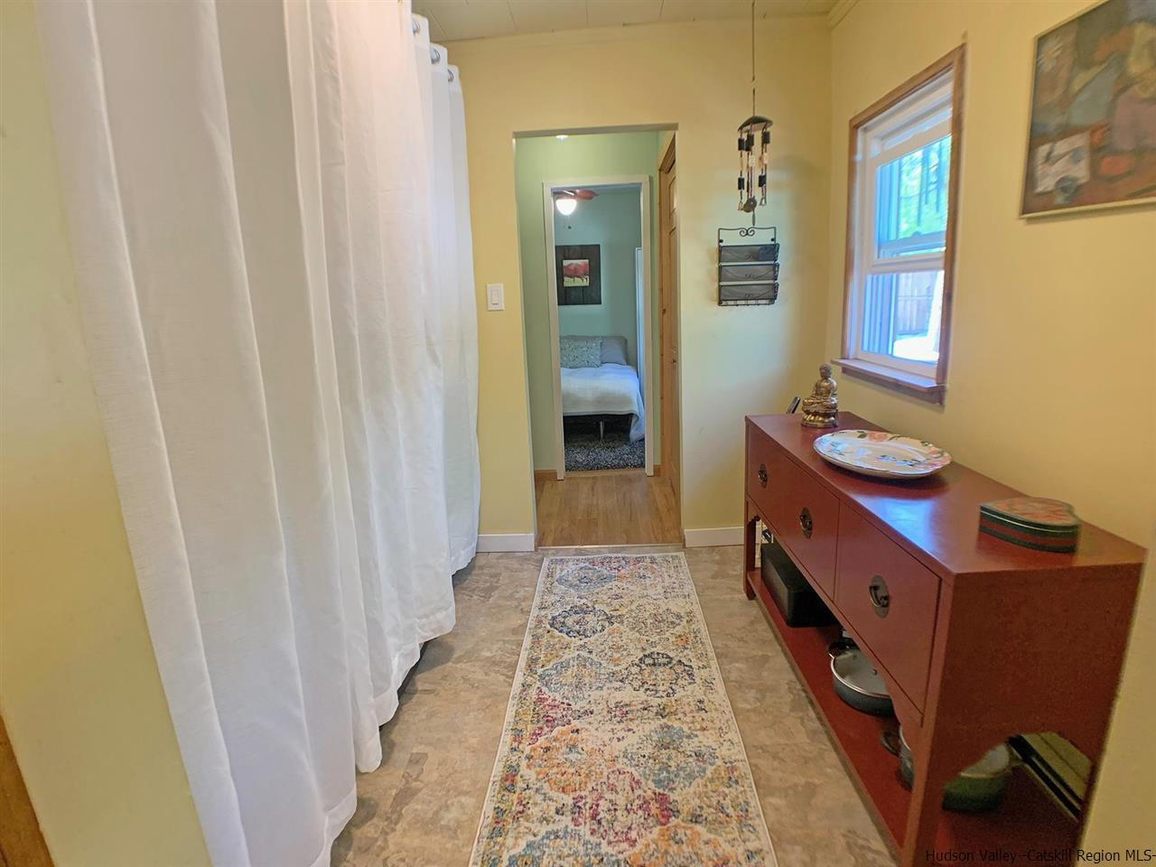 56 Bellwood Road Saugerties, NY 12477 - Photo 16 of 35 a bathroom with a sink a mirror and a shower