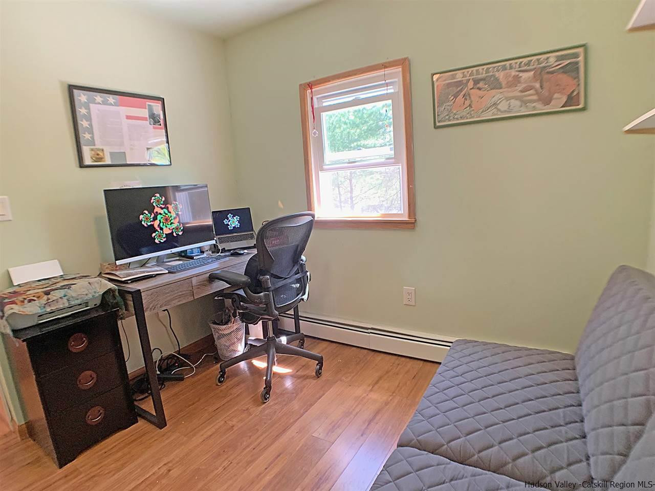 56 Bellwood Road Saugerties, NY 12477 - Photo 20 of 35 a view of a workspace with furniture and a window