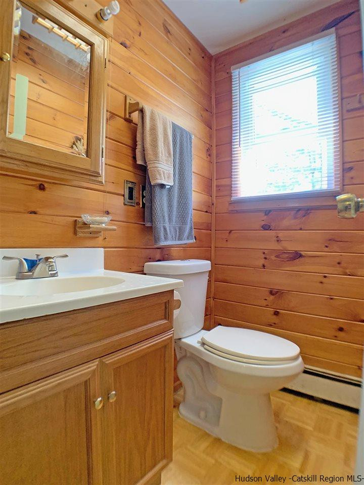 56 Bellwood Road Saugerties, NY 12477 - Photo 22 of 35 a bathroom with a sink a toilet and mirror