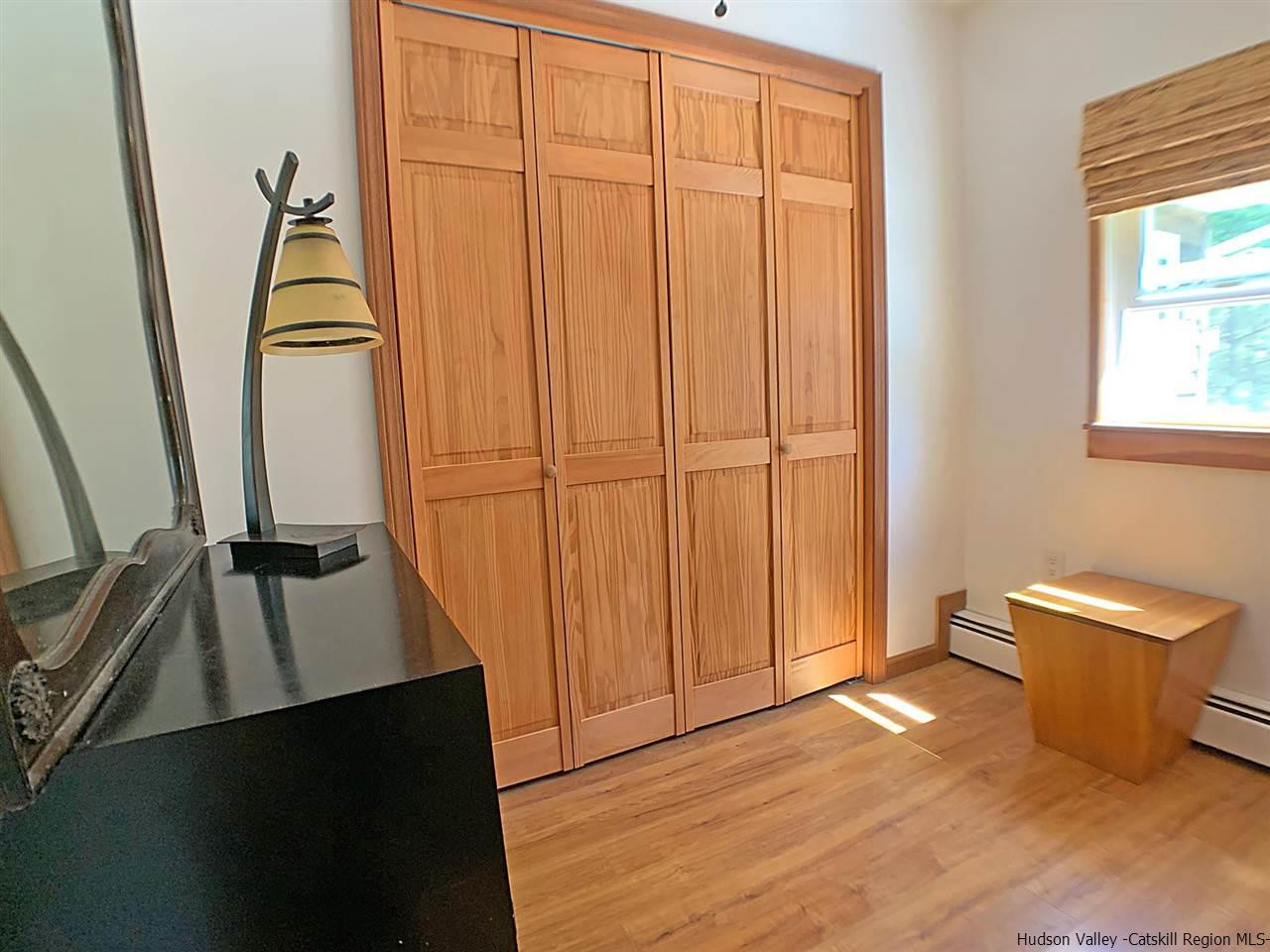 56 Bellwood Road Saugerties, NY 12477 - Photo 23 of 35 a view of an empty room with wooden floor and a window