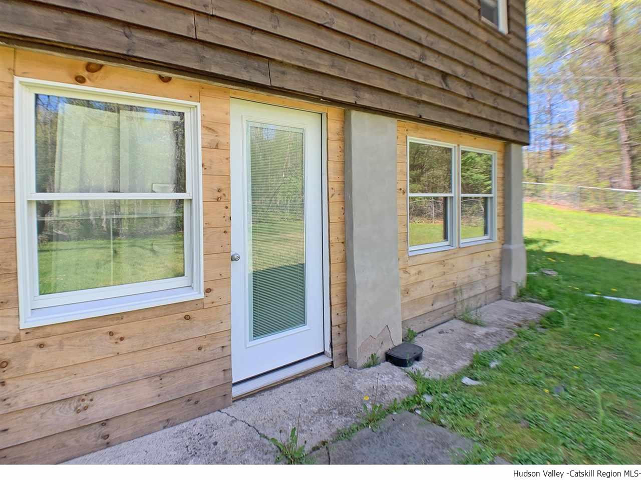 56 Bellwood Road Saugerties, NY 12477 - Photo 26 of 35 a front view of a house with a yard