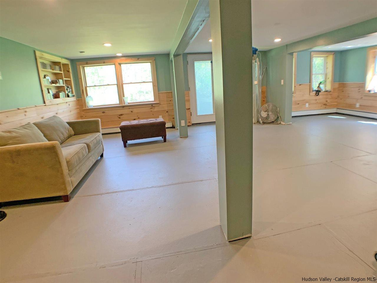 56 Bellwood Road Saugerties, NY 12477 - Photo 28 of 35 a living room with furniture and a large window