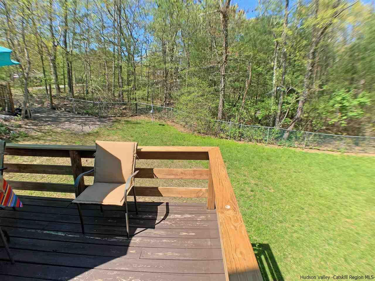 56 Bellwood Road Saugerties, NY 12477 - Photo 29 of 35 a view of a patio with two chairs and a table