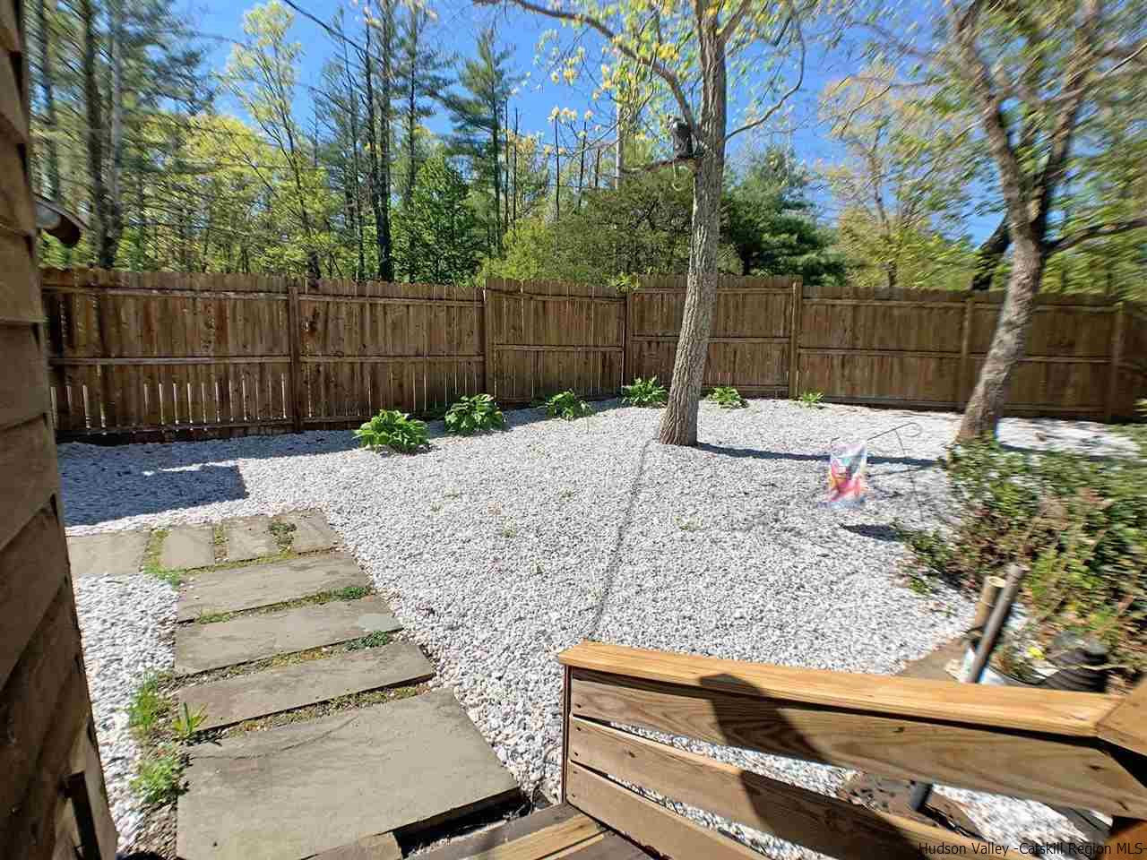56 Bellwood Road Saugerties, NY 12477 - Photo 30 of 35 a backyard of a house with table and chairs