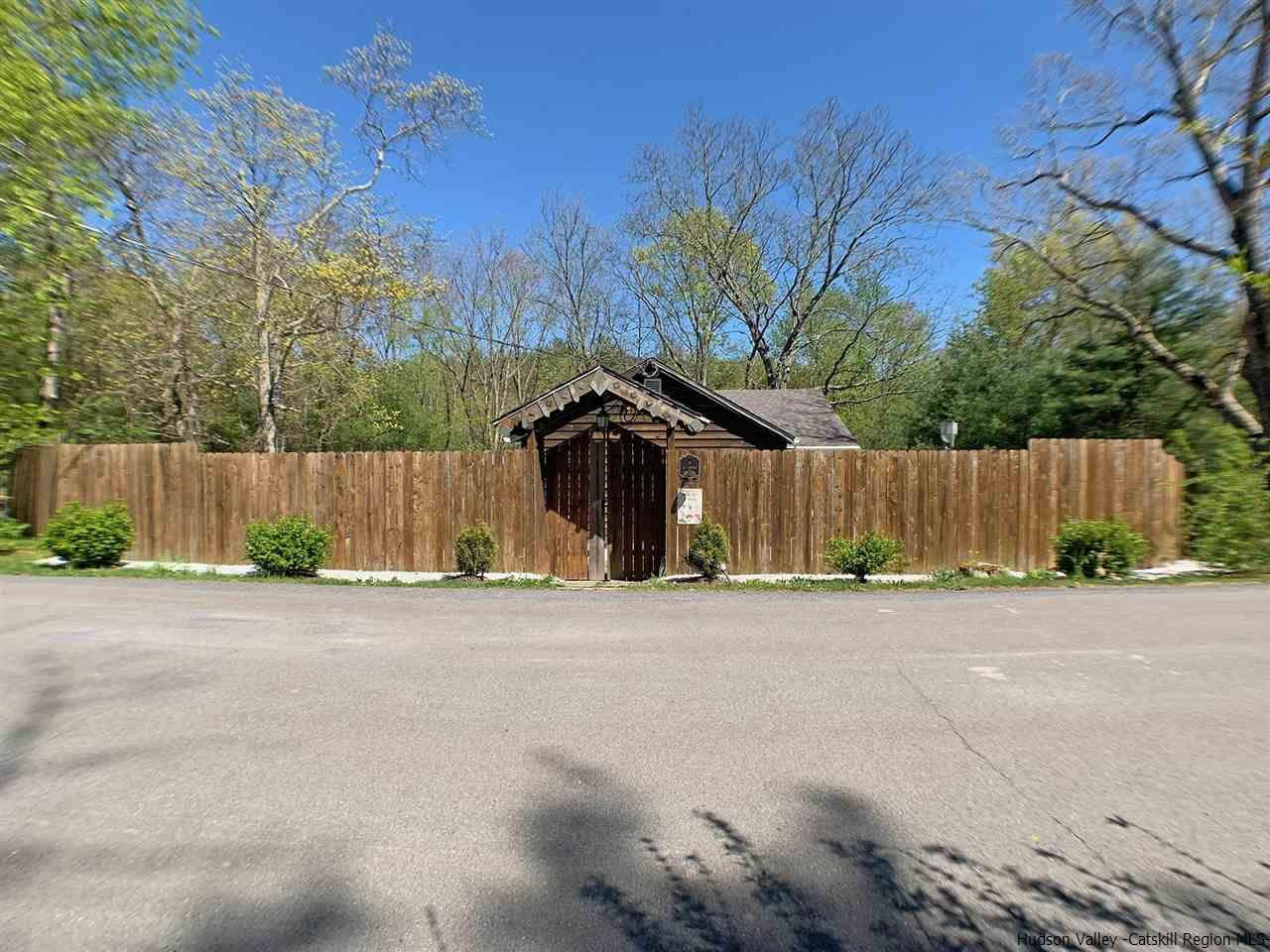 56 Bellwood Road Saugerties, NY 12477 - Photo 35 of 35 a wooden fence with some trees in the background