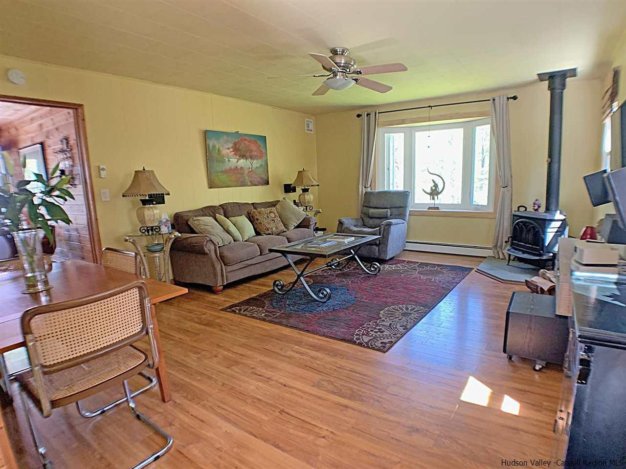 56 Bellwood Road Saugerties, NY 12477 - Photo 4 of 35 a living room with furniture a window and a flat screen tv